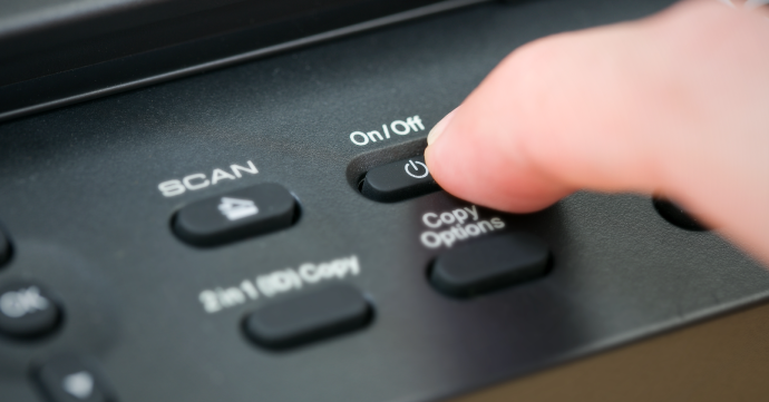 Pressing the Power Button on a Printer pressing the power button on a printer
