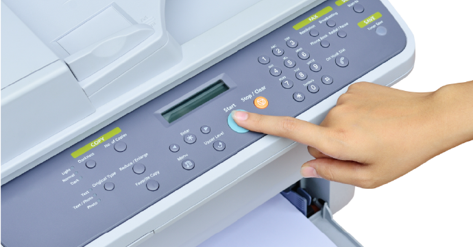 Pressing the Print Button on a Printer Pressing the print button on a printer.