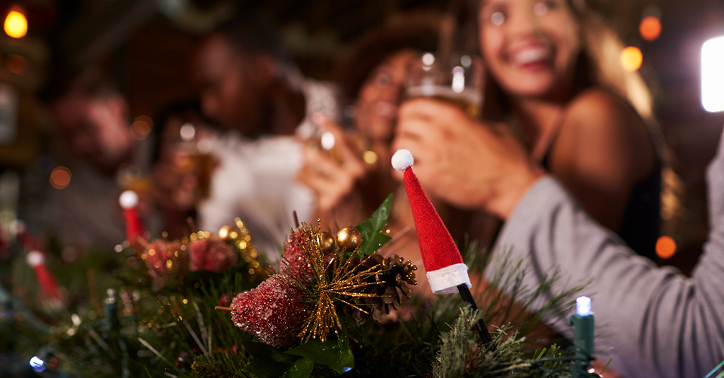 Festive Table Decorations Festive table decorations with partygoers in soft focus.