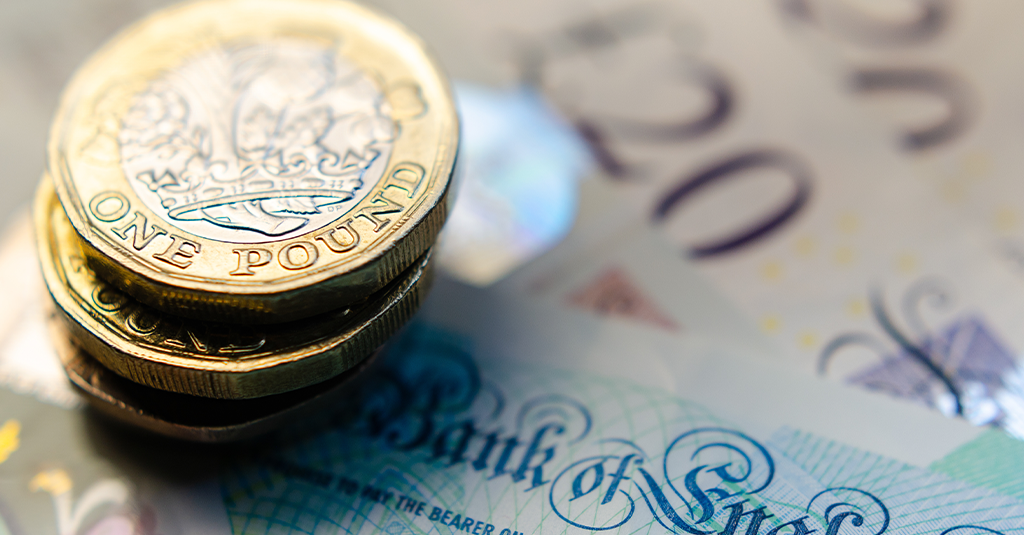 The Cost of Christmas Parties Pound coins and bank notes.