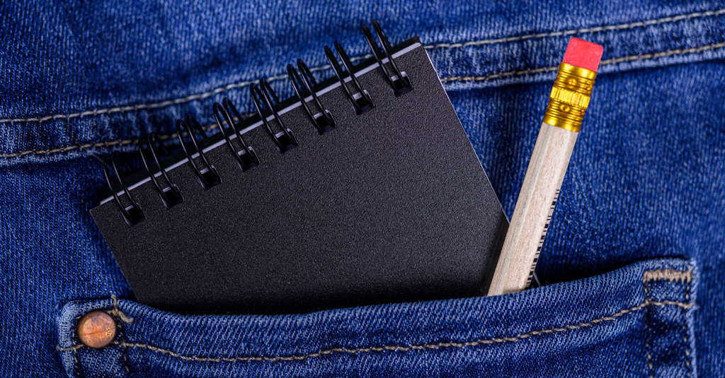 Pocket Notebook A notebook and pencil in a pocket.