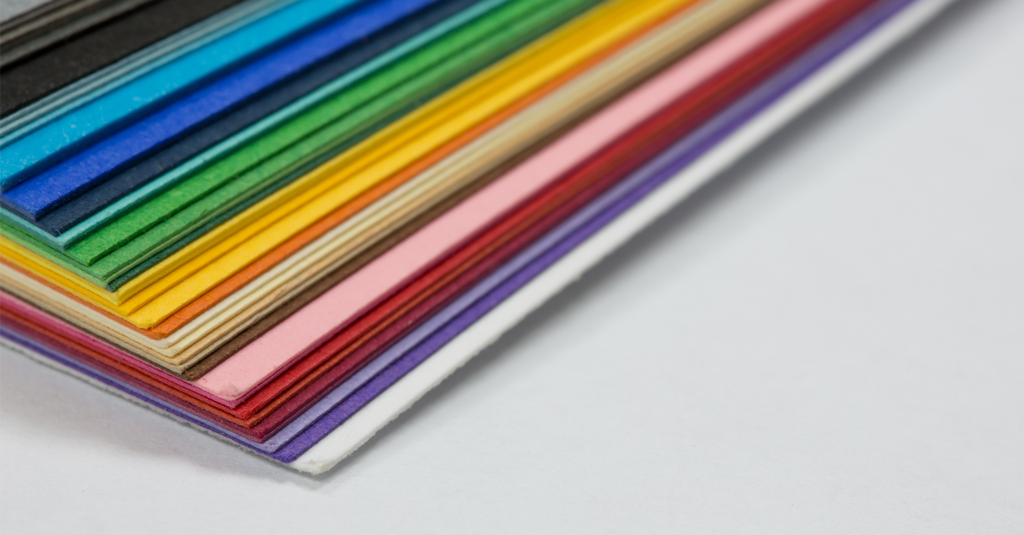 Cardstock Pile of cardstock in assorted colours.